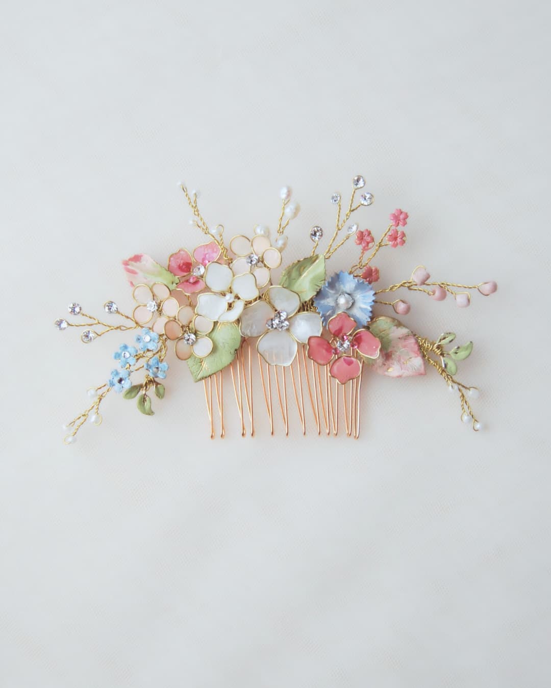 Pettinino sposa Millefiori Elibre con bouquet di fiori pastello, perle e cristalli Swarovski.