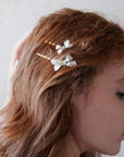 Set di mollettine con fiocco madreperlato per acconciature da sposa moderne, eleganti e sofisticate