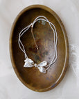 collana da sposa con perle e fiocco laterale