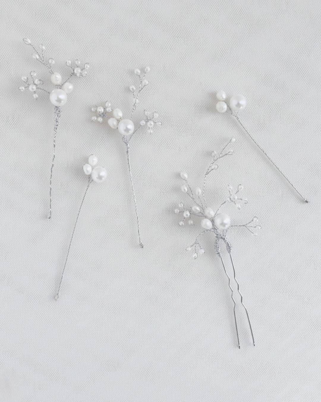 forcine con perle naturali e giapponesi in finitura argento