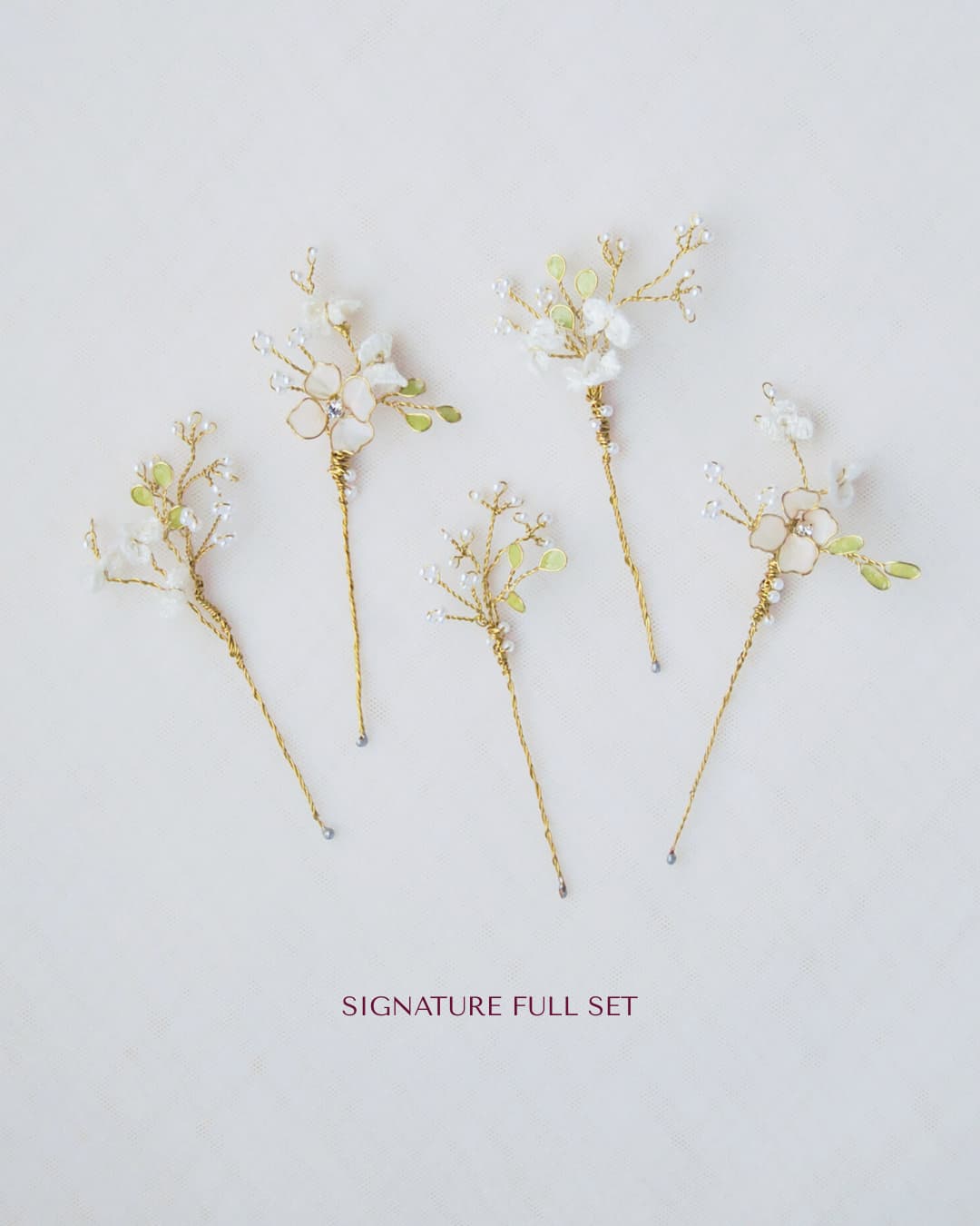 Composizione completa delle 5 forcine gioiello Nebbiolina realizzate a mano per un lusso etereo e botanico.