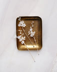 forcine frostalia per capelli da sposa con fiori satinati